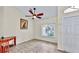 Bright room with a window view and interior door, complete with a ceiling fan and neutral color palette at 140 Sage Cir, Crystal Beach, FL 34681