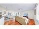Inviting living room with a comfortable sofa, hardwood floors, and TV at 140 Sage Cir, Crystal Beach, FL 34681