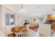 Open floor plan with a dining table connecting the kitchen and living area at 140 Sage Cir, Crystal Beach, FL 34681