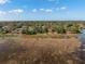 Aerial landscape view of the neighborhood and surrounding marshland at 1472 Ivydale Rd, Spring Hill, FL 34606