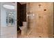 Luxurious bathroom featuring a glass enclosed shower with decorative wall coverings at 1520 Gulf Blvd # Ph1 1901, Clearwater Beach, FL 33767