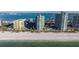 A view of condos next to the ocean on a sunny day at 1520 Gulf Blvd # Ph1 1901, Clearwater Beach, FL 33767