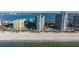 A view of condos next to the ocean on a sunny day at 1520 Gulf Blvd # Ph1 1901, Clearwater Beach, FL 33767