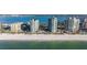 Beachfront condos with turquoise windows are shown from the shoreline at 1520 Gulf Blvd # Ph1 1901, Clearwater Beach, FL 33767