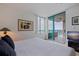 Bright bedroom with white walls, balcony access with ocean views, and contemporary decor at 1520 Gulf Blvd # Ph1 1901, Clearwater Beach, FL 33767