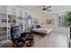 Cozy bedroom features a bookshelf, chair and expansive windows for lots of natural light at 1520 Gulf Blvd # Ph1 1901, Clearwater Beach, FL 33767