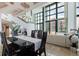 Elegant dining area with stairway, floor-to-ceiling windows at 1520 Gulf Blvd # Ph1 1901, Clearwater Beach, FL 33767