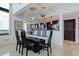 Dining room boasts modern table and chairs and is adjacent to the kitchen at 1520 Gulf Blvd # Ph1 1901, Clearwater Beach, FL 33767