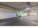 Spacious parking garage with ample lighting, featuring a convenient garage door at 1520 Gulf Blvd # Ph1 1901, Clearwater Beach, FL 33767