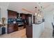 Modern kitchen with stainless steel appliances and dark wood cabinets at 1520 Gulf Blvd # Ph1 1901, Clearwater Beach, FL 33767