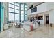 Spacious living area boasts large windows and sleek marble floors at 1520 Gulf Blvd # Ph1 1901, Clearwater Beach, FL 33767