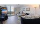 Modern living room with a large sofa, balcony access, and stylish decor at 1520 Gulf Blvd # Ph1 1901, Clearwater Beach, FL 33767