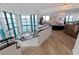 Bright living room featuring an open floor plan, lots of natural light, and beautiful staircase at 1520 Gulf Blvd # Ph1 1901, Clearwater Beach, FL 33767