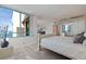 Bright main bedroom with a large window, mirrored closet and light wood floors at 1520 Gulf Blvd # Ph1 1901, Clearwater Beach, FL 33767