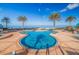 Relax by the gorgeous pool with palm trees, offering a resort-like oasis for residents at 1520 Gulf Blvd # Ph1 1901, Clearwater Beach, FL 33767