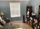 Comfortable living room with neutral walls, wood flooring, and a stylish bookcase at 1811 Ridge S Rd, Largo, FL 33778