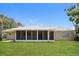 The backyard features a covered patio area perfect for outdoor living and entertaining at 18663 Kerrville Cir, Port Charlotte, FL 33948