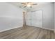 Bedroom featuring a ceiling fan, wood-look flooring, and a closet at 18663 Kerrville Cir, Port Charlotte, FL 33948