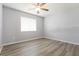 Bright and airy bedroom featuring a ceiling fan and natural light at 18663 Kerrville Cir, Port Charlotte, FL 33948