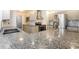 Modern kitchen with stainless steel appliances, sleek cabinets, and granite countertops at 18663 Kerrville Cir, Port Charlotte, FL 33948
