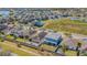 Aerial view of community with homes with grass and a pond in the background at 2111 Roanoke Springs Dr, Ruskin, FL 33570