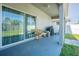 Back porch, featuring outdoor seating and a view of the backyard at 2111 Roanoke Springs Dr, Ruskin, FL 33570