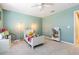 ' bedroom with soft green walls, carpet flooring, a ceiling fan, and a window with blinds at 2111 Roanoke Springs Dr, Ruskin, FL 33570