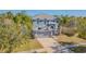 Inviting two-story home with a well-maintained lawn, mature trees and a two car garage at 2111 Roanoke Springs Dr, Ruskin, FL 33570