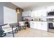 Modern eat-in kitchen featuring granite countertops, white subway tile, and stainless steel appliances at 2111 Roanoke Springs Dr, Ruskin, FL 33570