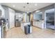 Well-lit kitchen features stainless steel appliances, granite countertops, and white cabinets at 2111 Roanoke Springs Dr, Ruskin, FL 33570