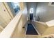 View of a staircase leading to a front entrance with a decorative window at 2111 Roanoke Springs Dr, Ruskin, FL 33570
