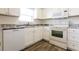 Modern kitchen featuring white cabinetry, stainless steel appliances, and elegant countertops at 28 Caddy Rd, Rotonda West, FL 33947