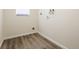 Empty laundry room featuring modern flooring and the necessary connections for laundry appliances at 28 Caddy Rd, Rotonda West, FL 33947