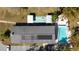 Aerial view of community pool and recreational areas on a sunny day at 300 Glennes Ln # 203, Dunedin, FL 34698