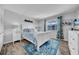 Bedroom featuring natural light, a blue rug, and nautical decor at 300 Glennes Ln # 203, Dunedin, FL 34698