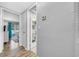 Hallway view to living room and bathroom at 300 Glennes Ln # 203, Dunedin, FL 34698