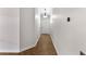 Inviting hallway with elegant herringbone wood flooring leading to the front door at 306 Oakwood Blvd, Oldsmar, FL 34677