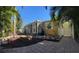 This landscaped backyard features a brick patio, beautiful garden, and a cozy fire pit at 4710 22Nd N Ave, St Petersburg, FL 33713