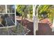 Backyard featuring lush landscaping, a charming arbor, and a screened-in porch for outdoor living at 4710 22Nd N Ave, St Petersburg, FL 33713