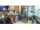 Modern kitchen with stainless steel appliances, granite countertops, and a decorative stone backsplash at 4710 22Nd N Ave, St Petersburg, FL 33713
