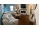 Bright living room with a modern fireplace, sleek flooring, and comfortable white seating at 4710 22Nd N Ave, St Petersburg, FL 33713