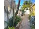 Landscaped walkway featuring brick pavers and lush plantings leading through the yard to a gate at 4710 22Nd N Ave, St Petersburg, FL 33713