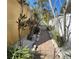 Landscaped walkway featuring brick pavers, lush plantings, and decorative rocks leading through the yard at 4710 22Nd N Ave, St Petersburg, FL 33713