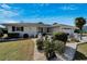 Charming home showcasing a landscaped front yard with white rock and mature Bird of Paradise at 612 Allegheny Dr, Sun City Center, FL 33573
