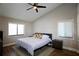 Inviting bedroom features hardwood floors, ceiling fan, and windows that provide natural light and a cozy ambiance at 6307 Songbird Way, Tampa, FL 33625