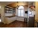 Cozy kitchen nook featuring a butcher block countertop, stainless steel appliances, and modern wood-look flooring at 6307 Songbird Way, Tampa, FL 33625