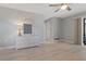 Light and bright bedroom featuring a ceiling fan, dresser, and view of the pool at 710 Treasure Boat Way, Sarasota, FL 34242