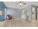 Spacious bedroom with an ensuite bathroom, ceiling fan, and comfortable furnishings at 710 Treasure Boat Way, Sarasota, FL 34242