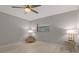 Bedroom features include a window with blinds, ceiling fan, and light wood-look flooring at 710 Treasure Boat Way, Sarasota, FL 34242