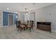 Charming dining room with modern chandelier and a wooden buffet cabinet at 710 Treasure Boat Way, Sarasota, FL 34242